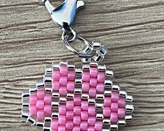 Brick Stitch Silver Trimmed Paw Print Charm.