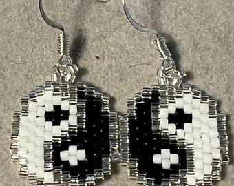 Yin and Yang Dangler earrings.