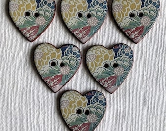 Set of 6 handmade, washable, lightweight, ceramic heart shaped buttons. 25mm (1 inch) wide. Warner Textile Archive designs. Vintage look.