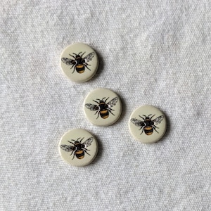 Set of 4 Extra Small, washable, lightweight, handmade, ceramic Bumble Bee Buttons 14mm diameter (a fraction over half an inch).