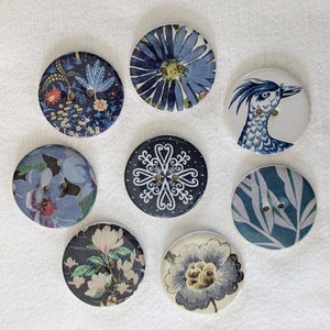 Set of 8 handmade 29mm, just over one inch, ceramic buttons with beautiful designs from the Warner Textile Archive collection. One set only.
