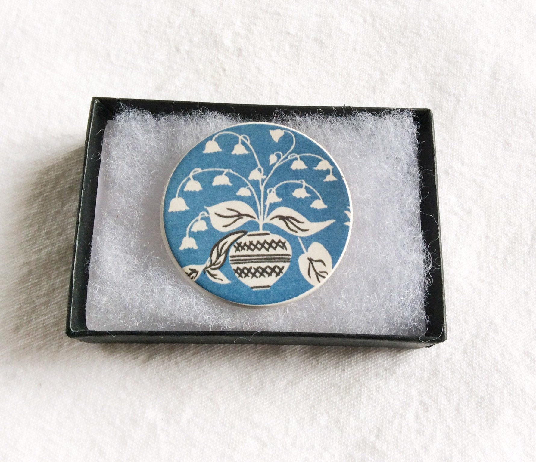 blue Heritage Mother's Day Gift. Round ceramic handmade Design courtesy of the Warner Textile Archive Lily of the Valley Brooch