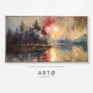 May include: A framed landscape painting shows a lake scene with trees and fireworks. The artwork uses blues, greens, and warm tones. The painting has a vintage style, with the text "ARTØ VINTAGE FRAME TV ART" at the bottom.