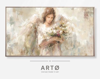 May include: A framed painting of an angel holding flowers, rendered in soft, muted tones of beige, white, and brown. The artwork features a serene figure with outstretched wings, creating a calming and elegant aesthetic. The text "ARTØ VINTAGE FRAME TV ART" is at the bottom.