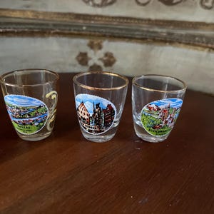 Vintage German liquor shot glasses, set of 3 from different German cities. 2x2 inches. Set of 3.
