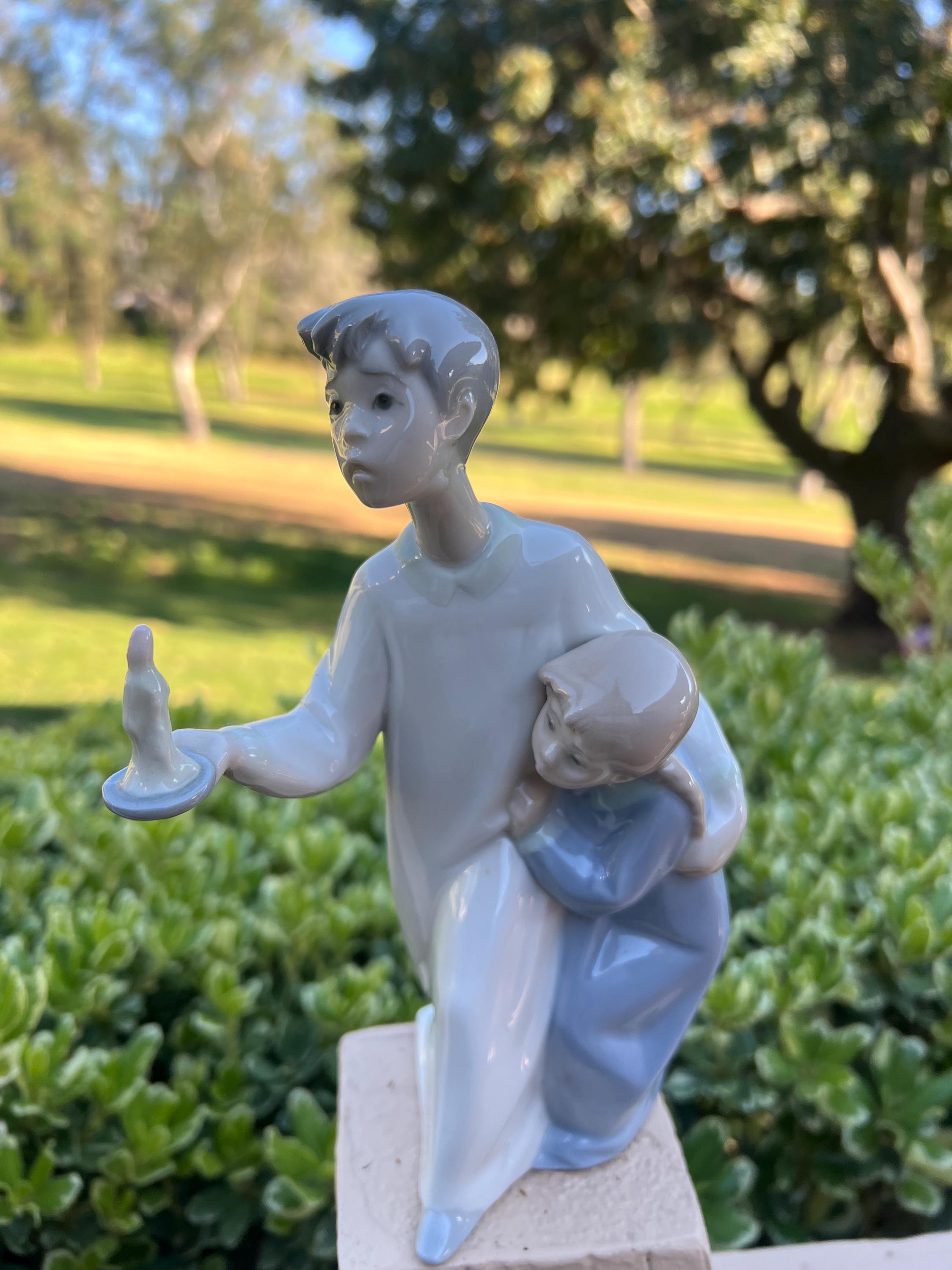 Lladro, Sculpture of Boy and Little Sister Holding a Candle Stick