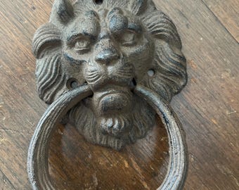 Antique Cast Iron Lion head door knocker. Cast iron brown bronze color. 7x4 inches. New vtg condition.