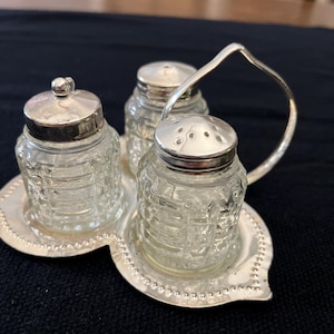 Vintage silver-plated holder cruet, condiment set, salt, pepper and mustard. Glass. 4 pieces. 5x7x3&quot;.
