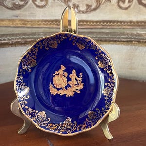 Vintage Cobal blue and 22k gold details, Victorian couple. Ruffled edges. 4&quot; diameter. Made in Limoges France.