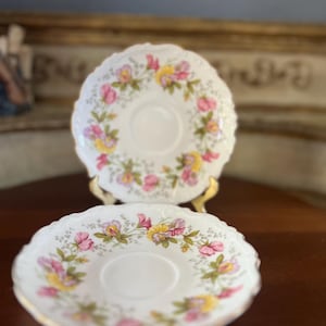 Beautiful, &quot;Marylin&quot; Coalport bone China saucers. Pink, purple and yellow flowers. 5.5&quot; diameter.