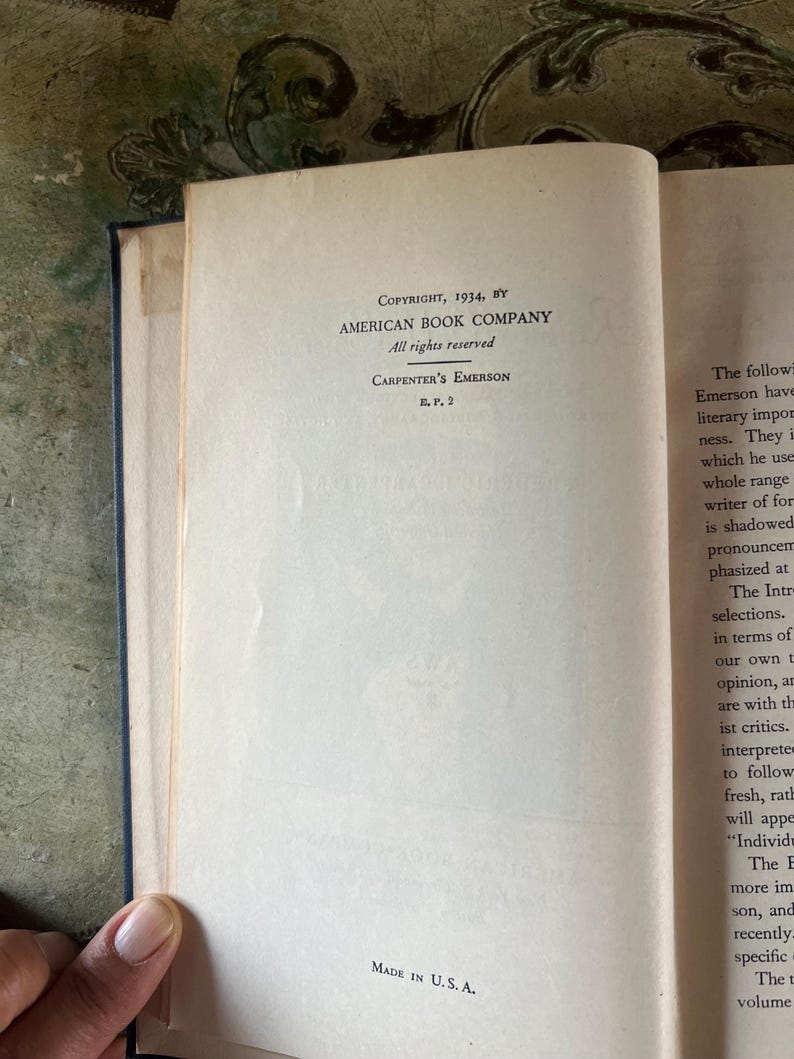 May include: A close-up of a book's copyright page, showing the text "Copyright, 1934, by American Book Company. All rights reserved. Carpenter's Emerson E.P. 2. Made in U.S.A."