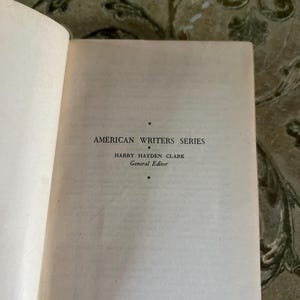 May include: A book cover with the text "American Writers Series" and "Harry Hayden Clark General Editor".