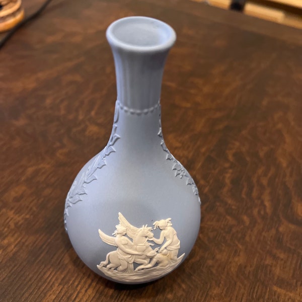 Antique Wedgwood Jasperware light blue Bud vase. 51/2 inches tall x 3 inches wide. Women and Pegasus on a boat. Good condition.