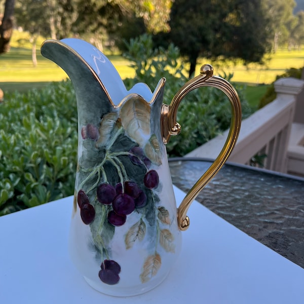 Beautiful Limoges, France hand painted Porcelain pitcher hand painted. Pristine condition. 9x6 inches.