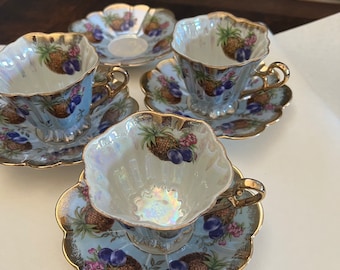 Antique Shafford Japan, teacup and saucer. Hand painted. Pineapples and plums. Lustre Lilac with gold rim.