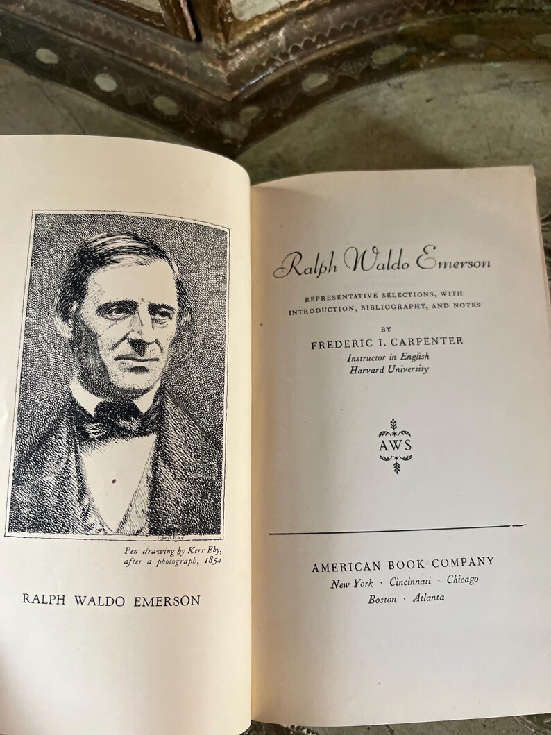 May include: A black and white illustration of Ralph Waldo Emerson, an American essayist, poet, and philosopher. The image is from a pen drawing by Kerr Eby, after a photograph taken in 1854. The text below the image reads "Ralph Waldo Emerson".