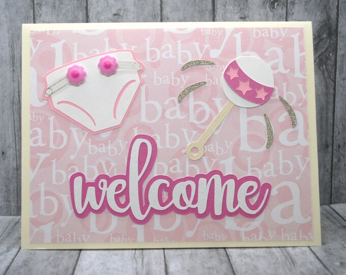 Welcome Baby Card: Pink Diaper and Rattle