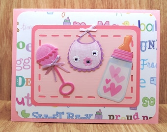 Baby Greeting Card: Bottle, Bib, Rattle - Pink