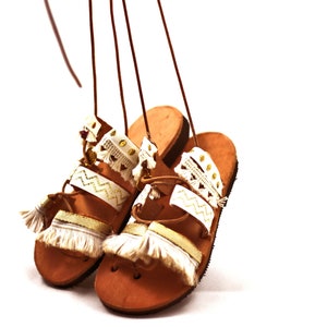 Gladiator sandals with pom pom ~ decorated with lace.