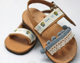 Sandals for toddler – Greek sandals with pompon and bee stamps make cute shoes gift for baby girl coming home. Handmade baby shoes gift idea