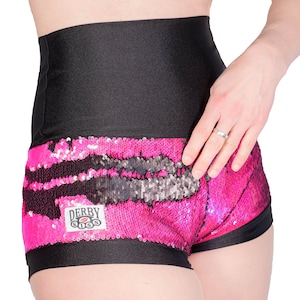 May include: Pink and black sequined shorts with a black waistband and a "Derby Kiss" logo patch.