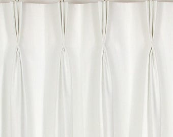 May include: White curtains with pleats hanging from a gold curtain rod.