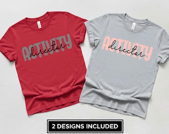 May include: Two t-shirts, one red and one grey, each with the words "ACTIVITY director" printed on the front. The text is in a playful font, with "ACTIVITY" in a bold, blocky style and "director" in a cursive script. The bottom of the image reads "2 DESIGNS INCLUDED".