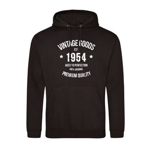 May include: Black hooded sweatshirt with white text that reads "Vintage Goods Est. 1954 Aged to Perfection 100% Original Premium Quality"