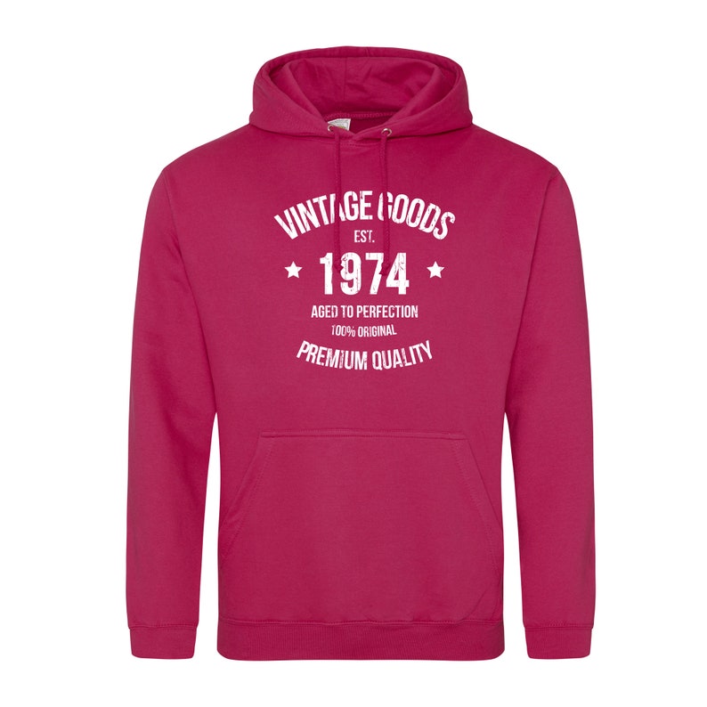 May include: A pink hooded sweatshirt with white text that reads "Vintage Goods Est. 1974 Aged to Perfection 100% Original Premium Quality".
