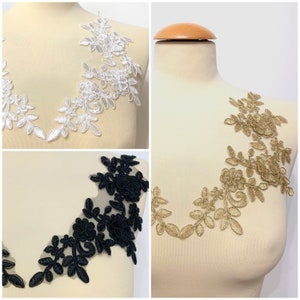 May include: Three lace appliques in different colors: white, gold, and black. Each applique features a floral design with delicate leaves and intricate details.