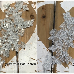 Puede incluir: Dos piezas de encaje gris con diseños florales. Una pieza tiene lentejuelas y el texto "grau mit Pailleten". La otra pieza tiene el texto "grau".