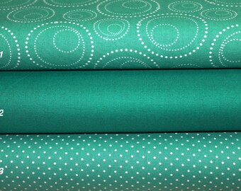 May include: Three fabric swatches in shades of teal green with white patterns. The top swatch has a white swirl pattern, the middle swatch is solid teal green, and the bottom swatch has a white polka dot pattern.