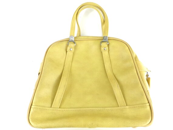 vintage american tourister luggage yellow