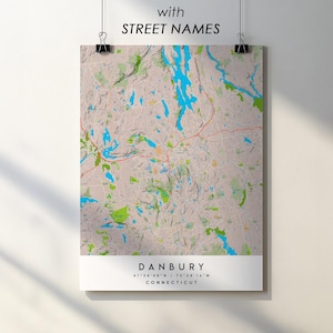 May include: A map print of Danbury, Connecticut, with street names. The map features a beige background with blue and green areas representing water and vegetation. The text "with STREET NAMES" is at the top, and the city name and coordinates are at the bottom.