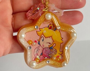 Porte-clés Princess Peach Showtime, cadeau mignon princesse pêche, shaker en résine pêche, décoration de sac de sables mouvants en résine kawaii, cadeau princesse pêche