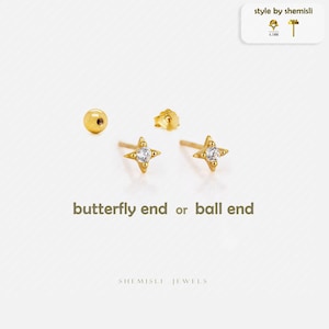 May include: Gold-coloured stud earrings with a starburst design and a small, round, gold-coloured earring back. The image also shows a gold ball stud earring and the text "butterfly end or ball end". The earrings are from Shemisli Jewels.