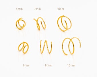 May include: A collection of gold-colored spiral earrings in various sizes, ranging from 5mm to 10mm. The earrings are displayed on a white background, showcasing their unique, coiled designs. The brand name, SHEMISLI JEWELS, is at the bottom.