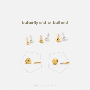May include: A selection of gold and silver ball-end earrings and butterfly-back earrings are displayed against a white background. The text "butterfly end or ball end" is above the earrings. The brand name "SHEMISLI JEWELS" is at the bottom.