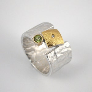Modern wide band ring made of 22K gold and 925 silver with a small diamond and a peridot stone, Hammered ring, Gift for her, Geometric ring.