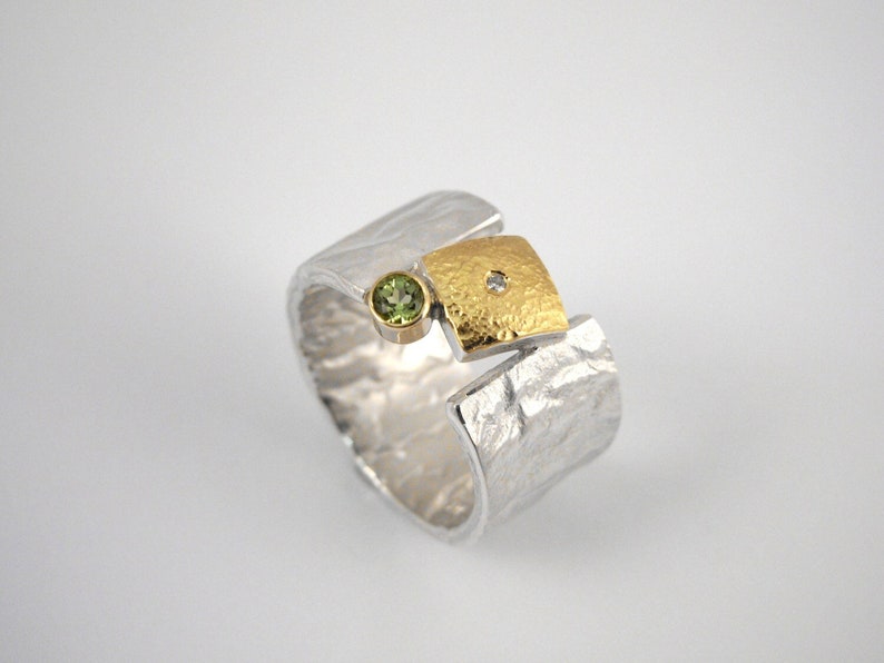 Modern wide band ring made of 22K gold and 925 silver with a small diamond and a peridot stone, Hammered ring, Gift for her, Geometric ring. Peridot