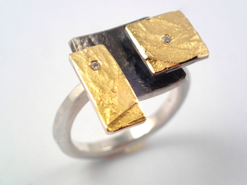 The Rubik's cube. An artistic geometric gold and silver ring with diamonds and hammered band for nights out. image 1