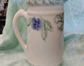 Crock Shop Pottery pitcher, Santa Ana, California, with green sponge ware trim on top and bottom rim, grapes, grape leaves, and purple plums