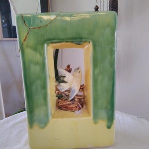 McCoy pottery vintage double sided vase with bird in window in the center, approximately 9&quot; tall x 7&quot; x 4&quot;, see pictures, sold as found