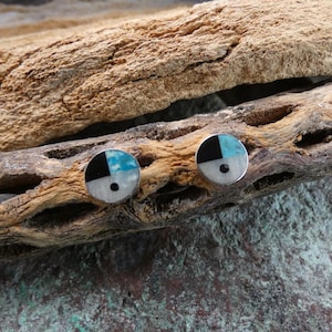 May include: A white ceramic mug with a black handle and the text "But First, Coffee" in a handwritten style. The mug is on a white surface. The mug is 4 inches tall.