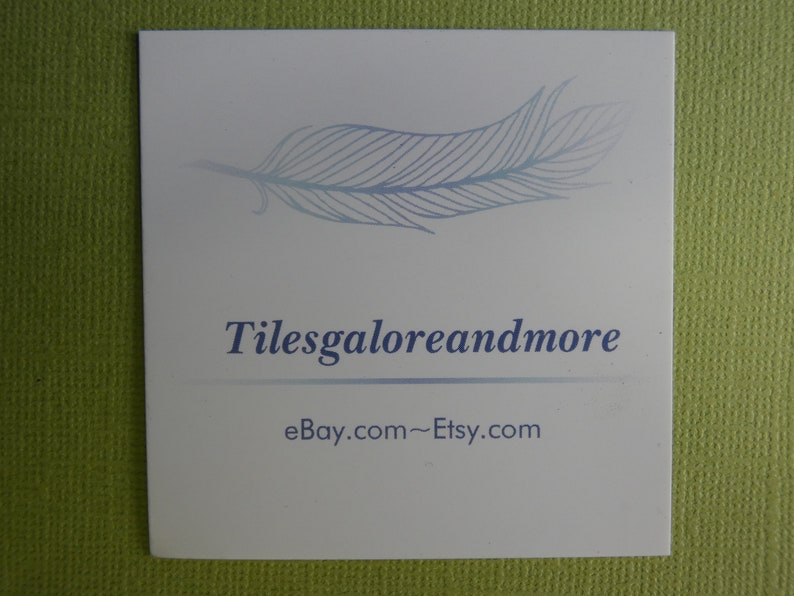 May include: A white business card with a blue feather design and the text "Tilesgaloreandmore" and "eBay.com~Etsy.com".