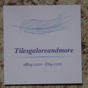 May include: A white business card with a blue feather design and the text "Tilesgaloreandmore" and "eBay.com~Etsy.com".