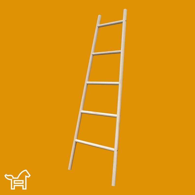 May include: A natural wood ladder style towel rack with four rungs. The rack is leaning against a yellow wall.