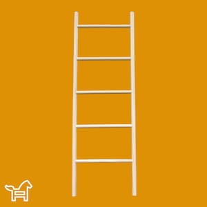 May include: A white wooden ladder shelf with four shelves. The ladder shelf is standing on a yellow background.