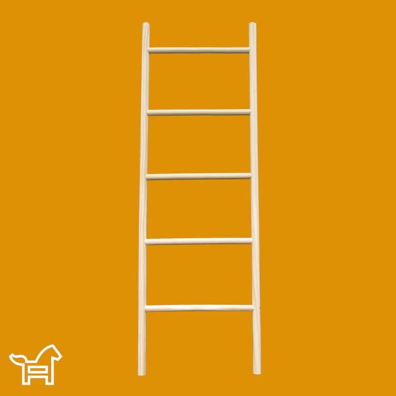 May include: A white wooden ladder shelf with four shelves. The ladder shelf is standing on a yellow background.