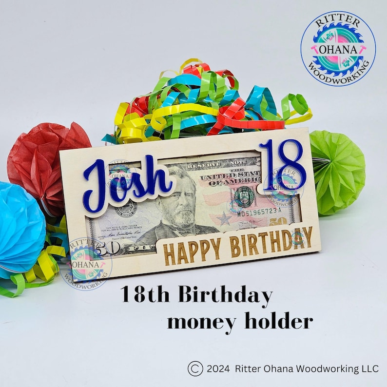May include: Wooden 18th birthday money holder with a slot for a bill. The holder is decorated with the name "Josh" and the words "Happy Birthday".